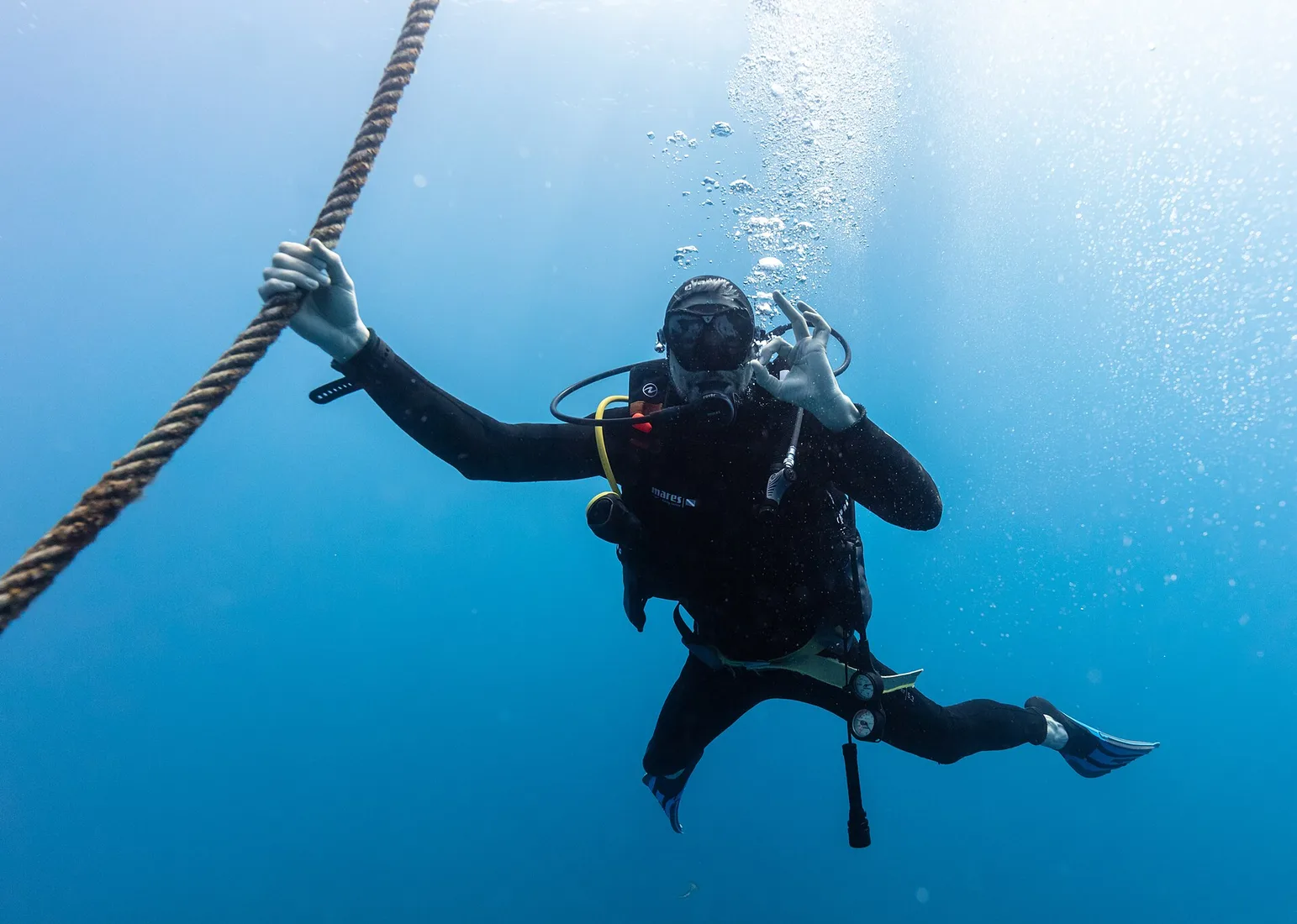 A diver over volcanic reef in the waters off Madeira