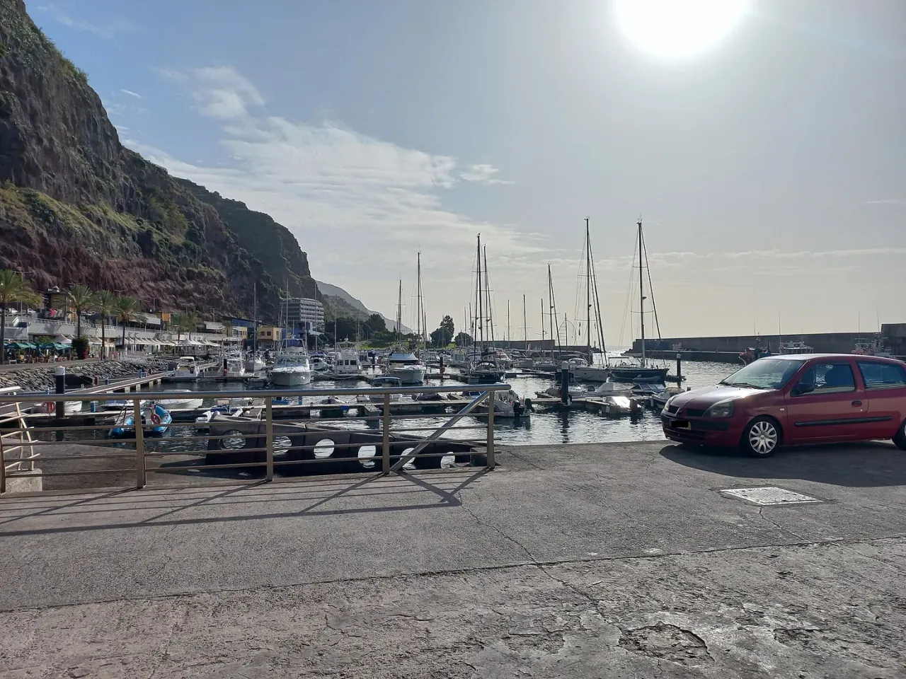Yachts moored inside the breakwater of Calheta marina on Madeira's south-west coast