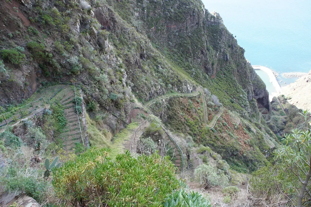 The cliff path dropping to Paul do Mar and its seafront on Madeira's west coast
