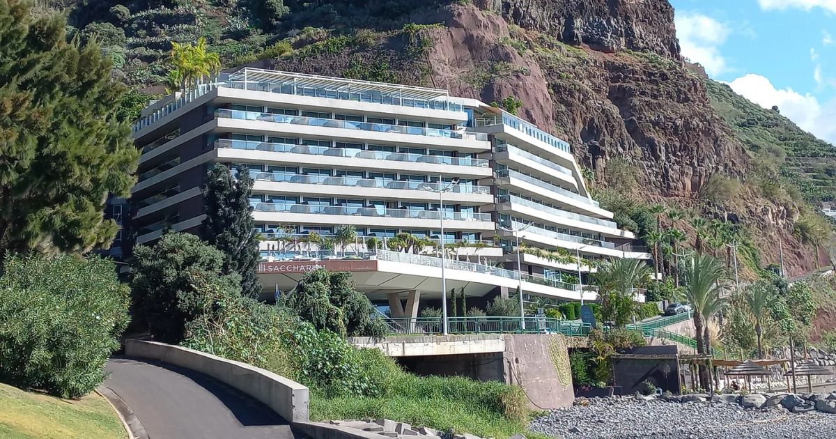 Hotels above the beach and harbour at Calheta